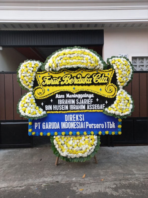 Papan Bunga Duka di Pantai Amal